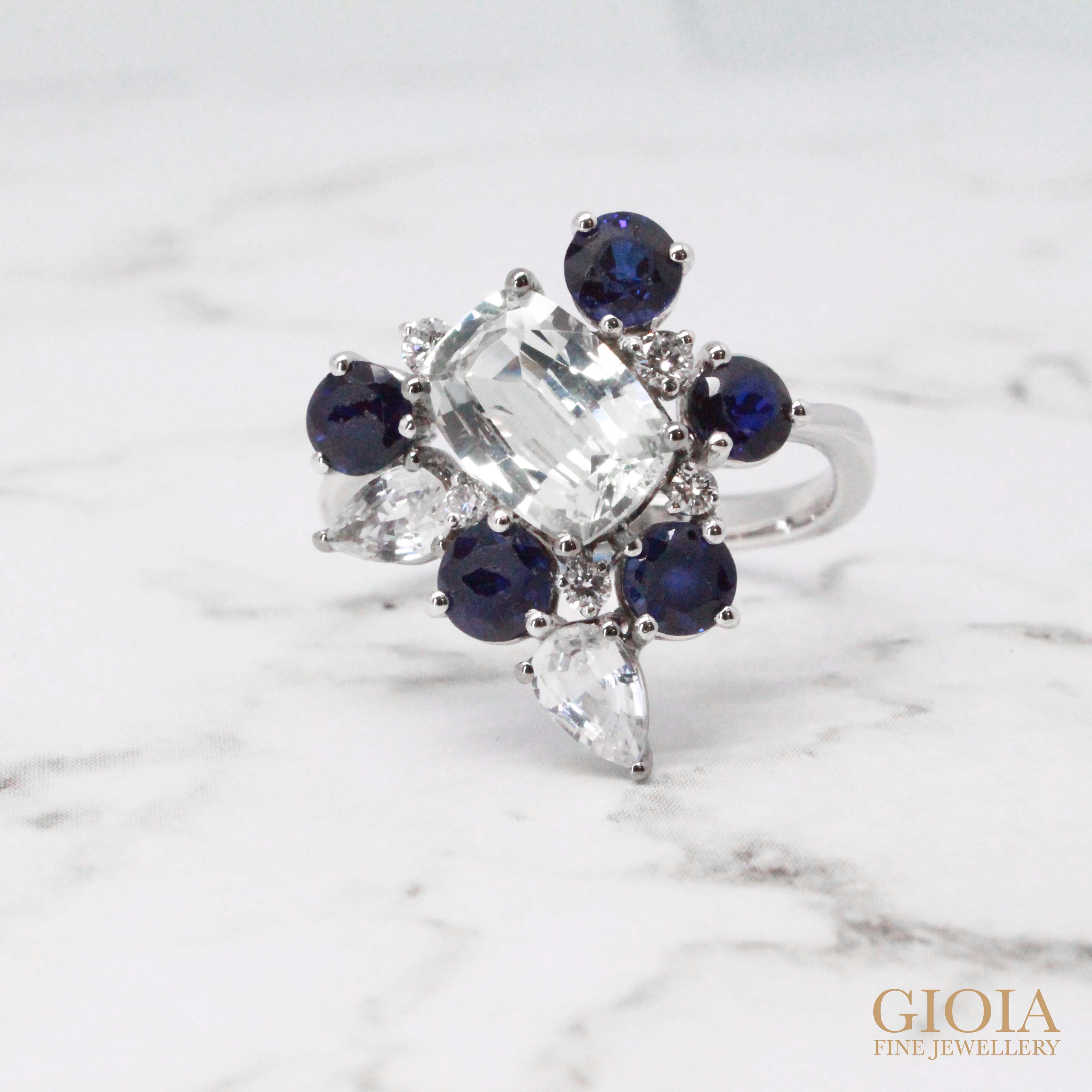 White and blue sapphire gemstone on existing jewellery. redesign and style to a unique jewellery design. Bespoke jewellery with different creation in GIOIA Fine Jewellery
