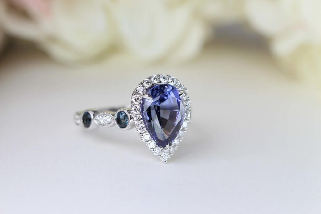 Customised Tanzanite Ring, Tanzanite with Violet, Blue with halo round diamond. Pear Shaped Tanzanite Gemstone Ring | Local Singapore Bespoke Fine Jewellery with Customised Jewellery GIOIA Fine Jewellery in Tanjong Pagar