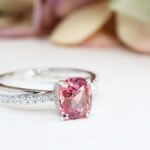 Padparadscha Sapphire customised with halo and twisted round brilliance diamond Engagement Ring - Customised Jewellery with orange and pink colour shade sapphire | Local Singapore customised jeweller in sapphire for wedding jewellery