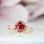 Engagement ring ruby features an unheat vivid red ruby rare gemstone. With a liking for flora design, we customised this engagement ring with marquise diamond with flora leaves and petals in rose gold surrounding the ruby gemstone | Local Singapore Jeweller in engagement ring and wedding jewellery.