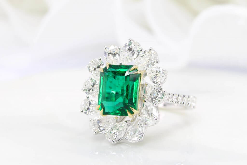 High Jewelry - Emerald Ring featuring vivid green emerald non oil with surrounding pear shape fancy diamond fine jewelry design by Bespoke Jewellery in Singapore GIOIA Fine Jewellery