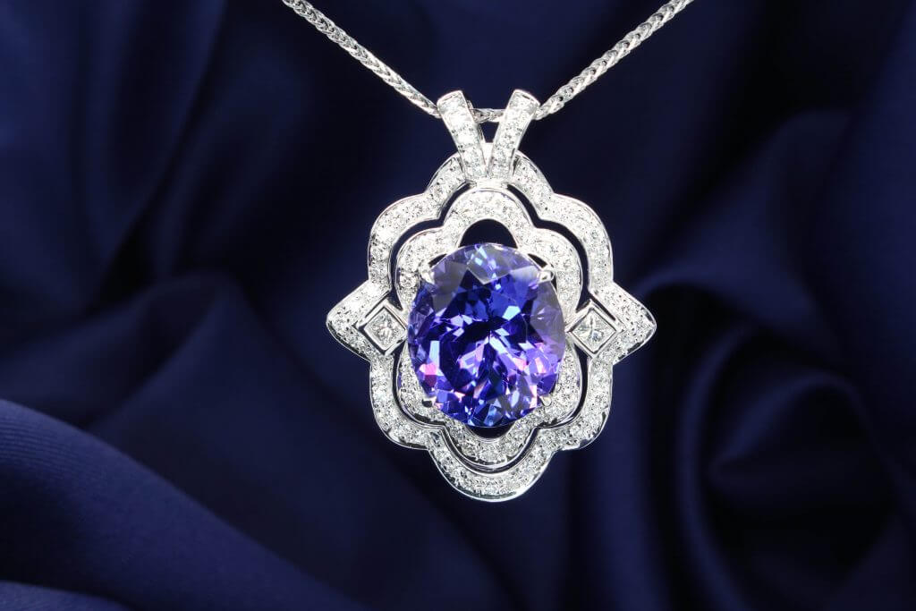 Art Deco Jewellery breath-taking piece of the symmetrical and geometric look. Tanzanite is birthstone gem for December. Bespoke Art Deco fine jewelry Singapore