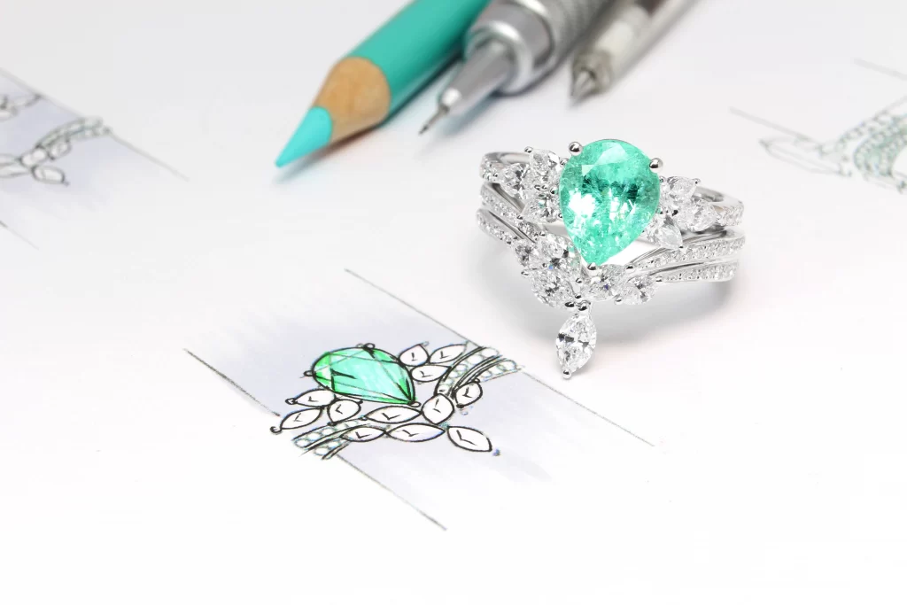 Paraiba Tourmaline Pear with Marquise Tiara Diamond Ring with Stackable Fine Jewellery Diamond Band Design High Jewelry GIOIA Fine Jewellery Best Gemstone Bespoke Jeweller in Singapore GIOIA Fine Jewellery Boutique Custom Jeweller in Singapore