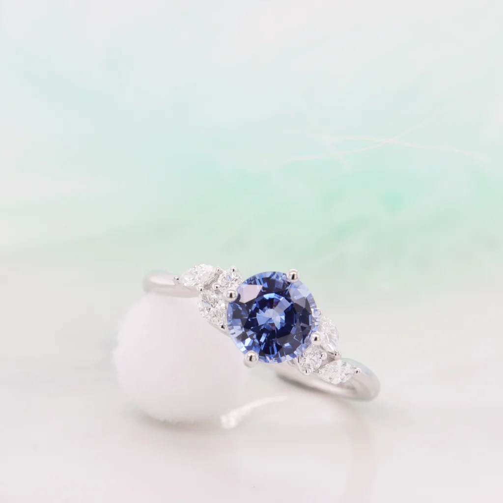 Blue Sapphire Engagement Ring Round Sapphire Diamond Marquise Ring Perspective 